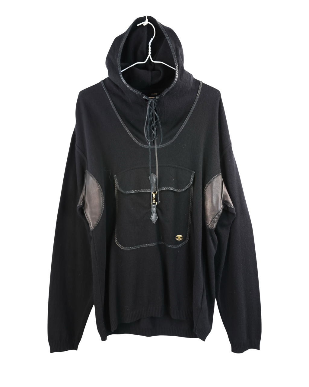 Black hoodie with gray accents on a white background. Roberto Cavalli Hooded Sweater. Roberto Cavalli black hooded knit sweater/hoodie; soft wool knit with leather-trimmed kangaroo pocket, leather elbow patches, lace-up neckline and contrast binding; relaxed/oversized fit, unisex; great with jeans, cargos, tailoring; style tags: rock, streetwear, Y2K, luxe casual; Italian luxury house craftsmanship, bold leather accents, collectible piece.