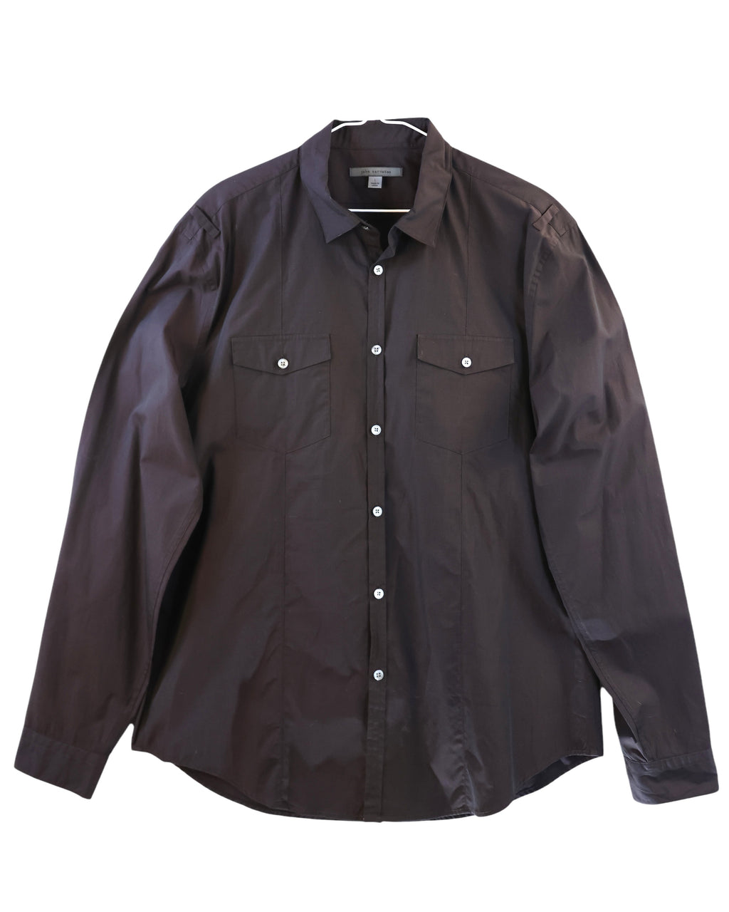 Dark brown shirt with two front pockets on a white background. John Varvatos deep aubergine / purple-brown micro-check cotton long-sleeve shirt; dual flap chest pockets, white buttons, straight hem; regular fit, unisex styling; great with denim, tailoring or workwear; tags: rock, minimal, utility; brand context: American luxury label from NYC known for artisanal rock-tailoring, 2000s vibe, rare vintage.