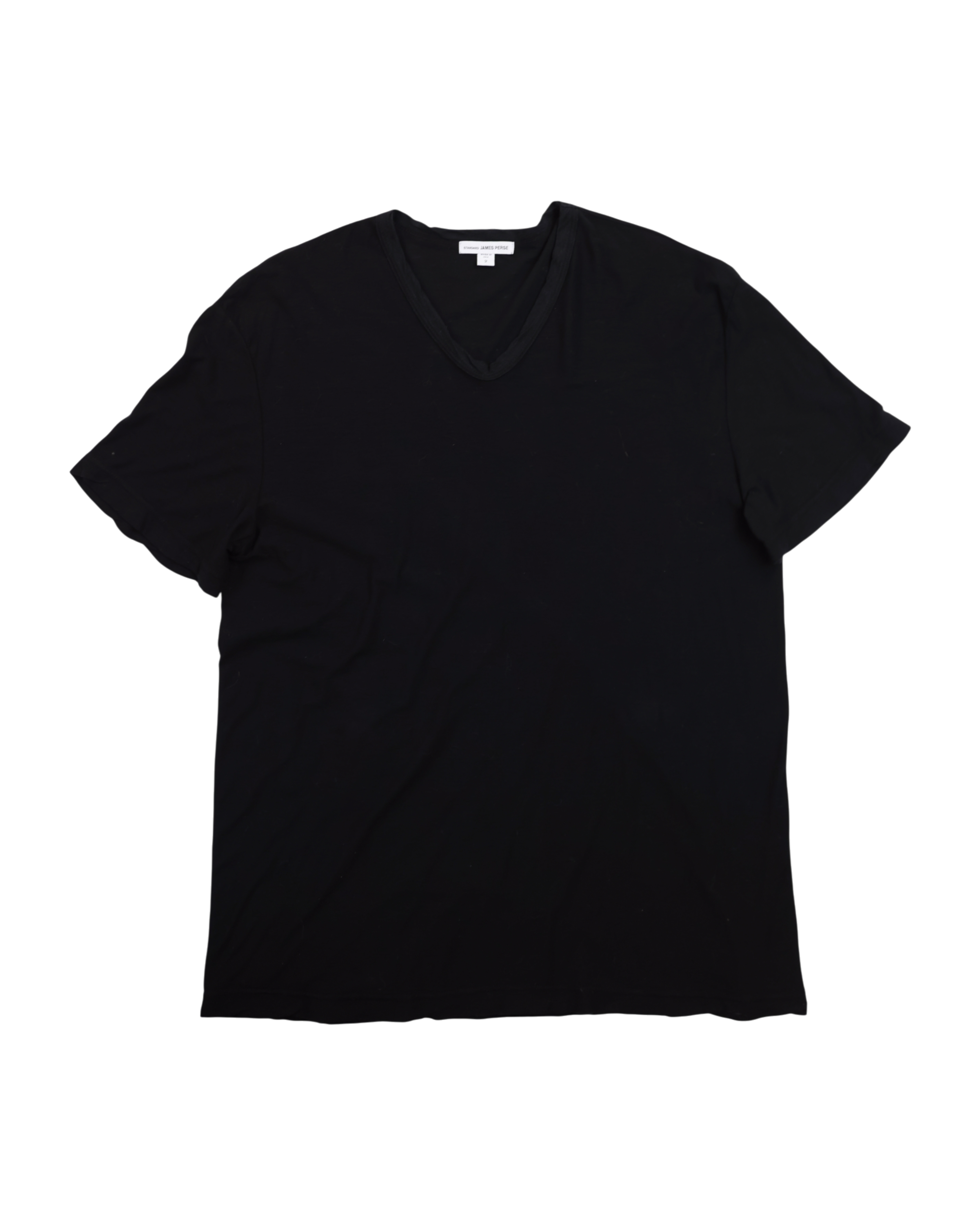 Black t-shirt on a white background. James Perse deep black V-neck short-sleeve T-shirt; soft premium cotton jersey with minimalist neckline and relaxed drape; lightweight breathable texture emphasizing understated California luxury; versatile wardrobe essential blending casual comfort and timeless refinement with signature laid-back elegance.