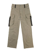 Vintage Dolce & Gabbana khaki cargo pants/trousers in sturdy woven fabric, mid-rise with relaxed straight leg, oversized flap utility pockets, grommeted straps and reinforced knees; button front with belt loops, workwear/streetwear-inspired luxury piece laid flat on white.