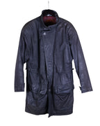 Vintage Bilermain long leather coat — designer outerwear with military/utility inspiration; longline parka/field-coat/duster silhouette in supple black/charcoal leather with rich patina; stand collar with throat latch, asymmetric storm-flap front, hidden zip + button placket; drawstring/adjustable waist, four oversized cargo/bellows pockets, adjustable cuffs; fully lined, rugged yet refined; unisex trench/overcoat statement piece; rare collectible.