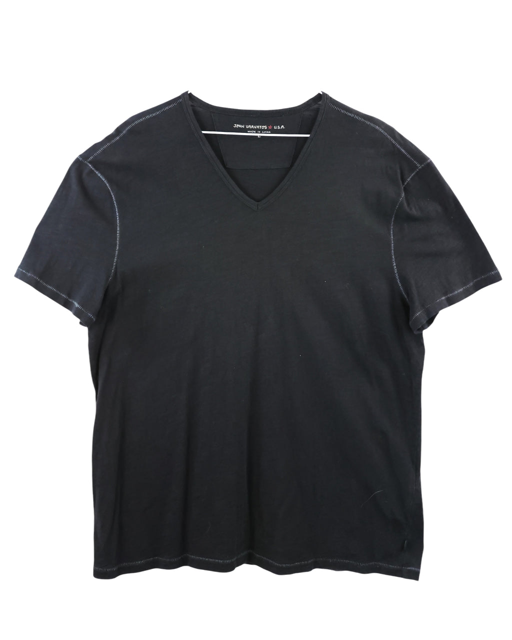 Black t-shirt on a white background. John Varvatos black V-neck cotton T-shirt; lightweight washed jersey with visible seam detailing and slightly relaxed silhouette; soft texture and minimalist finish evoke casual sophistication and vintage rock elegance; artisanal American craftsmanship meets refined everyday luxury for effortless layering.
