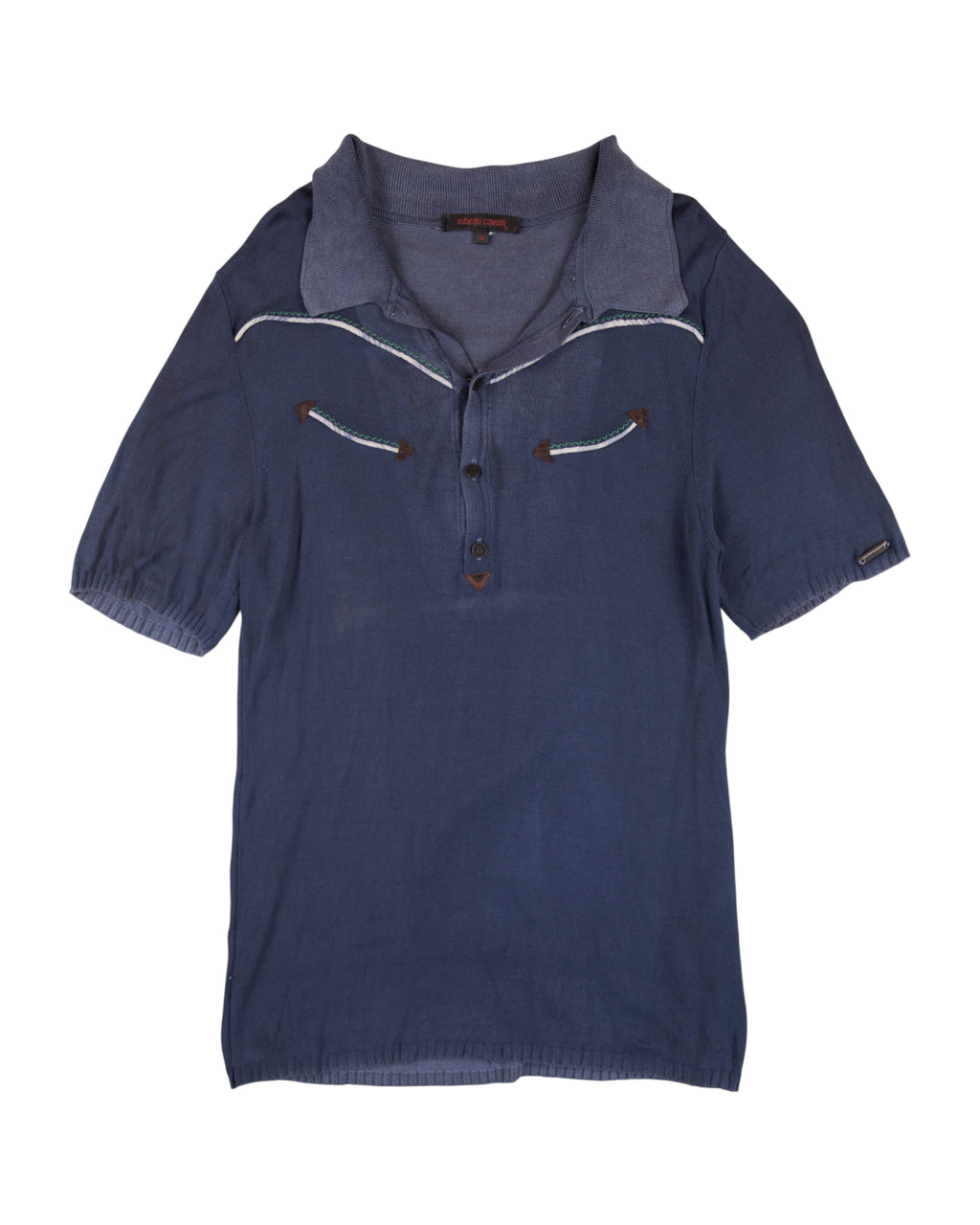 Blue polo shirt with white trim on a white background. Roberto Cavalli navy/ink-blue linen-cotton polo shirt; open half-placket and soft spread knit collar; contrast western piping with arrow appliqués at chest; short sleeves with elastic hems; lightweight summer knit; slim/regular fit, unisex casual; Y2K/western vibe; Italian luxury house craftsmanship, rare vintage.
