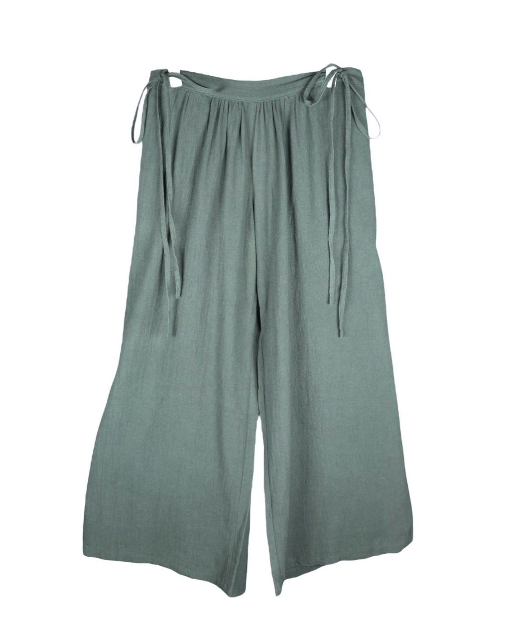 Second-hand Caravana sage-green bohemian pants/trousers in lightweight woven fabric; relaxed wide-leg palazzo/culotte cut with gathered waistband and adjustable side-tie fastenings, fluid drape and clean hems. Luxury artisan piece, rare and unique, laid flat on white.
