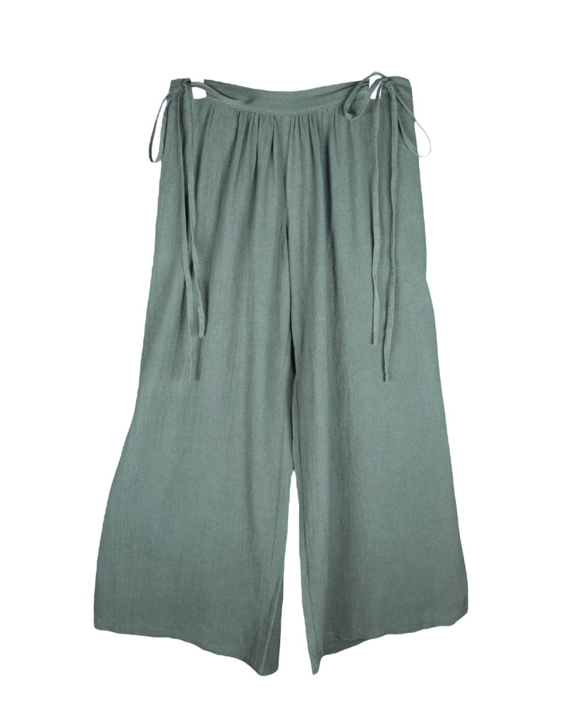 Second-hand Caravana sage-green bohemian pants/trousers in lightweight woven fabric; relaxed wide-leg palazzo/culotte cut with gathered waistband and adjustable side-tie fastenings, fluid drape and clean hems. Luxury artisan piece, rare and unique, laid flat on white.