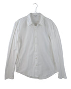 White shirt on a hanger against a white background. James Perse crisp white long-sleeve button-up shirt; smooth lightweight cotton fabric with pointed collar and minimalist tailoring; slightly relaxed fit for effortless sophistication; versatile wardrobe essential reflecting California luxury craftsmanship and timeless modern refinement for casual or dressed looks.
