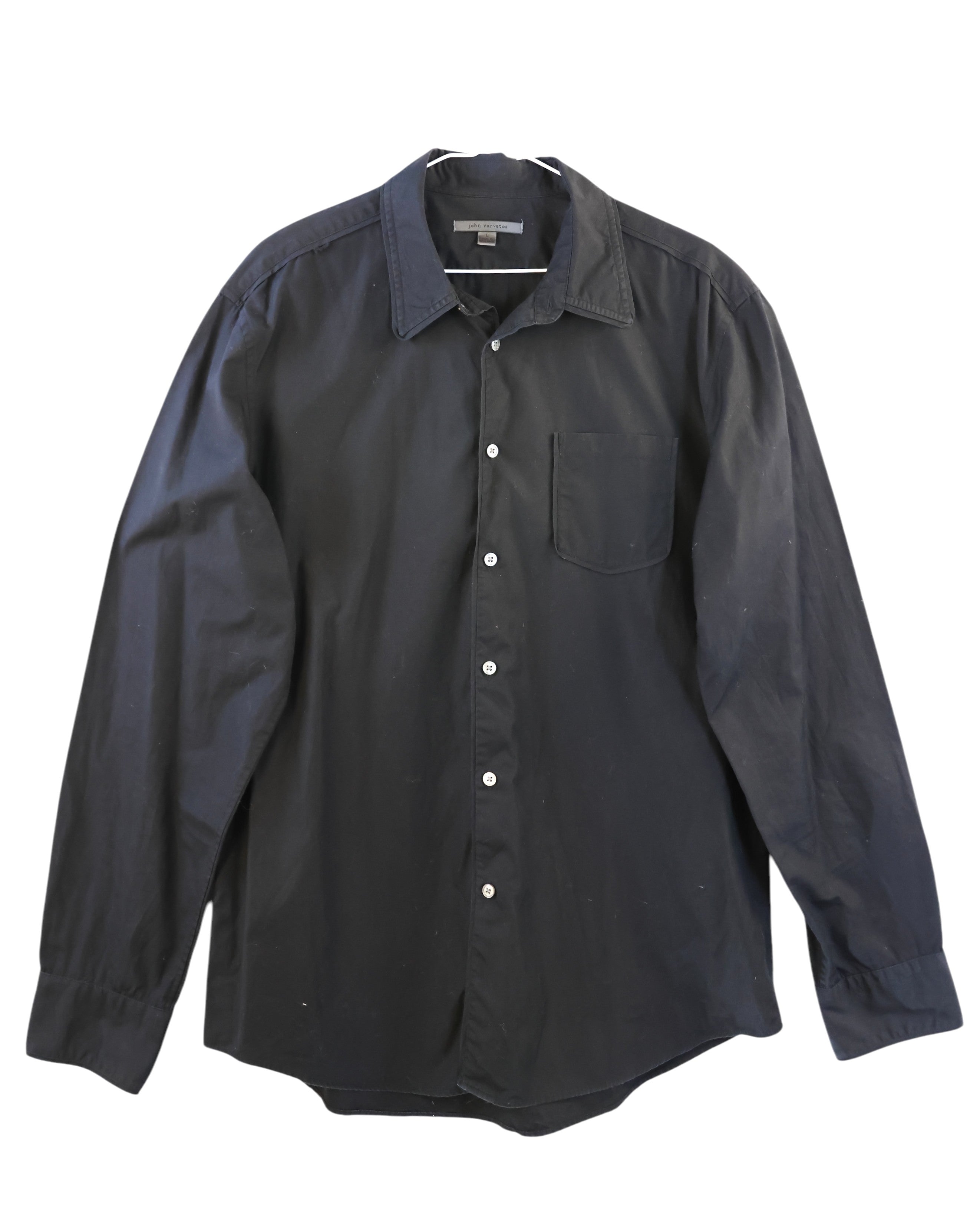 John Varvatos black cotton poplin button-up shirt; classic collar, white buttons, single chest pocket, curved hem; regular-slim fit, unisex; wears with denim, tailoring, leather jackets; style tags: rock, minimal, smart casual; brand context: American luxury label from NYC known for artisanal rock-tailoring; 2000s vibe, versatile wardrobe staple.
