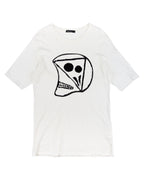 White t-shirt with a black graphic design on a white background. Undercover white/ivory cotton jersey T-shirt; bold black abstract skull/face graphic print, crewneck, short sleeves, slight distressing at hem; relaxed unisex fit; easy with denim, cargos or layered tailoring; style tags: punk, grunge, streetwear, graphic, avant-garde; brand context: Japanese cult label by Jun Takahashi, artisanal/luxury design.