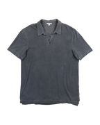 Gray polo shirt on a white background. James Perse washed charcoal grey short-sleeve polo shirt; soft garment-dyed cotton jersey with open collar and partial button placket; slightly distressed edges and relaxed fit evoke effortless California minimalism; premium quality piece blending casual refinement and understated luxury craftsmanship.