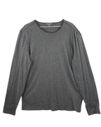 Gray long-sleeve shirt on a white background. John Varvatos dark grey/charcoal long-sleeve T-shirt; ultra-soft jersey, crew neck, clean hems; lightweight drape, comfortable stretch; relaxed modern fit, unisex; easy layering with denim, leather jackets, tailoring; style tags: rock, minimalist, casual luxe; brand context: American designer label with rock-inspired heritage craftsmanship; versatile wardrobe staple.